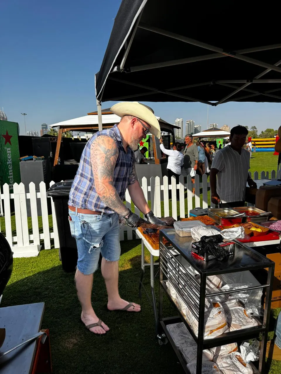 Pitmaster Dave serving smoked BBQ to guests at Keeping it Country